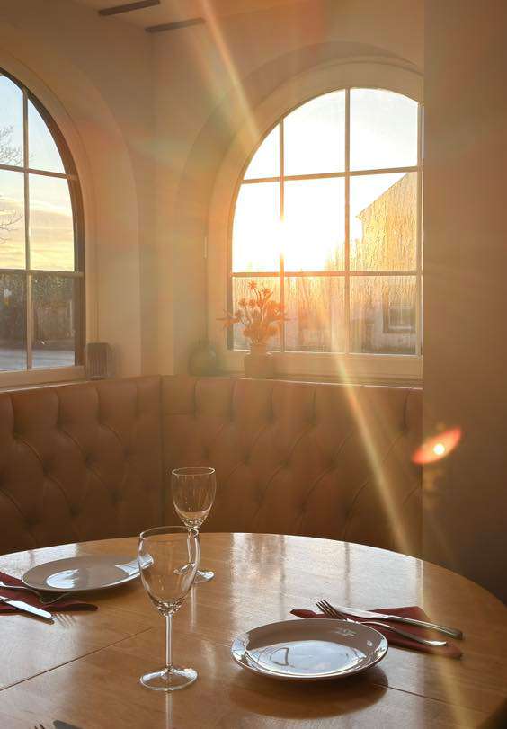 The interior of the Dora Turkish restaurant in Carlisle, with a ray of sunlight coming in through the window